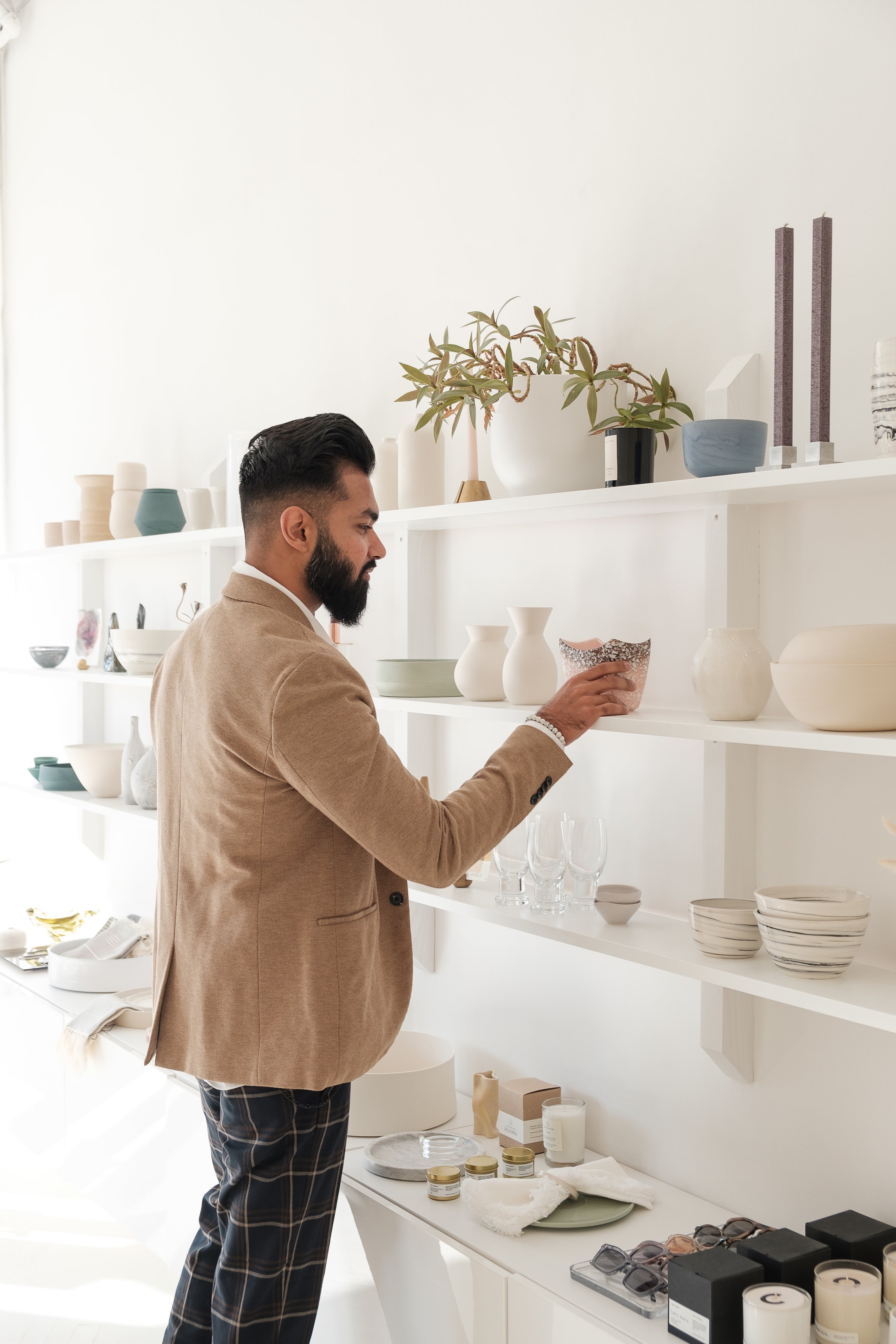files/young-man-looks-at-home-goods-in-store.jpg